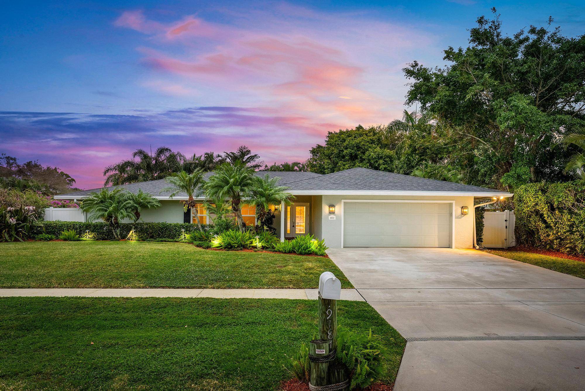 Must See this Beautiful 3 2 Home on oversized corner lot beautifully landscaped with lighting.