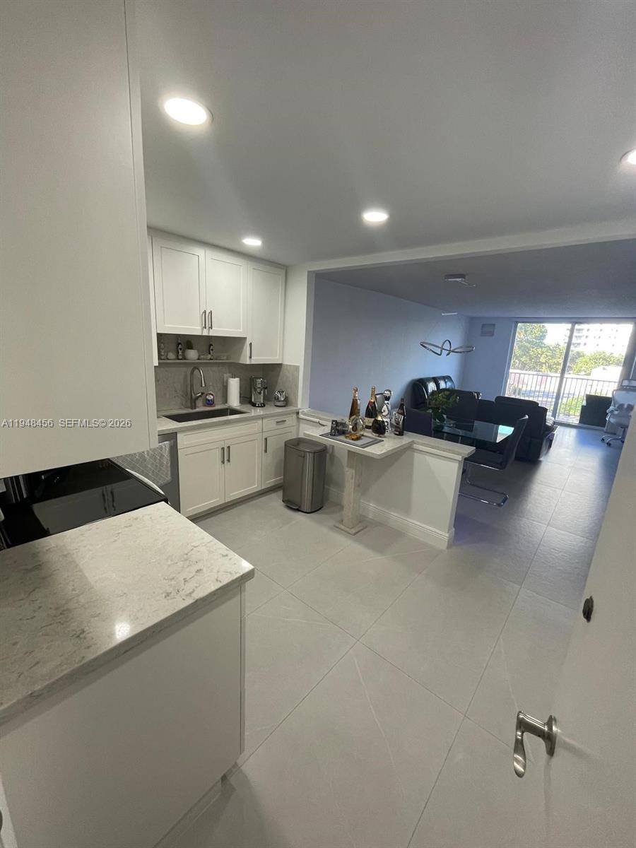 Take in stunning ocean and Intracoastal views from the covered balcony of this beautifully renovated Hollywood Beach condominium.