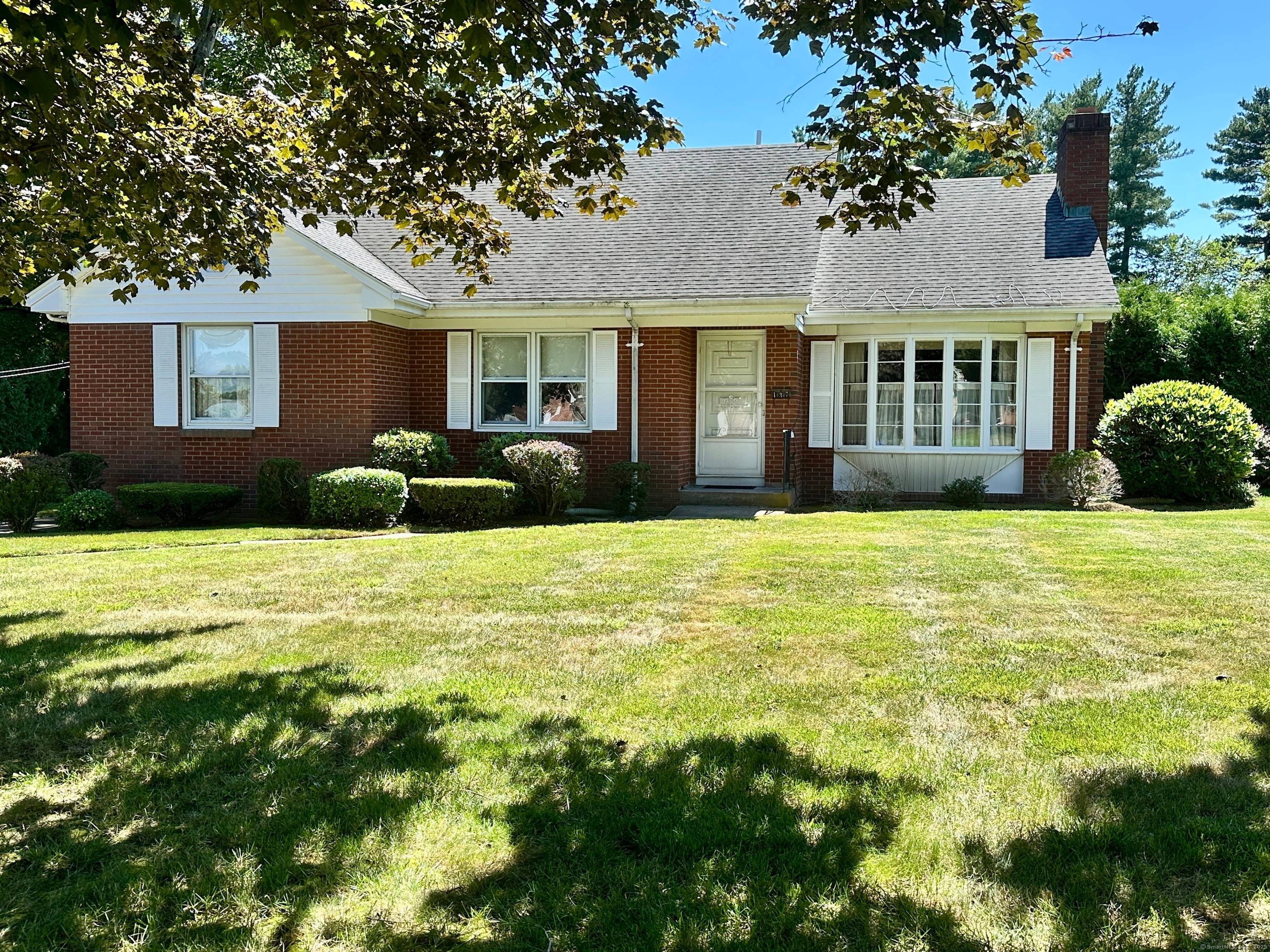 Welcome to 137 Elm St. A custom built, original owner brick cape nestled in the heart of Windsor Locks.