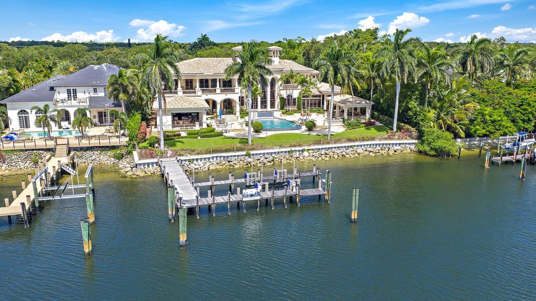 Experience the ultimate in luxury living at this exceptional Palm Beach Gardens waterfront estate.
