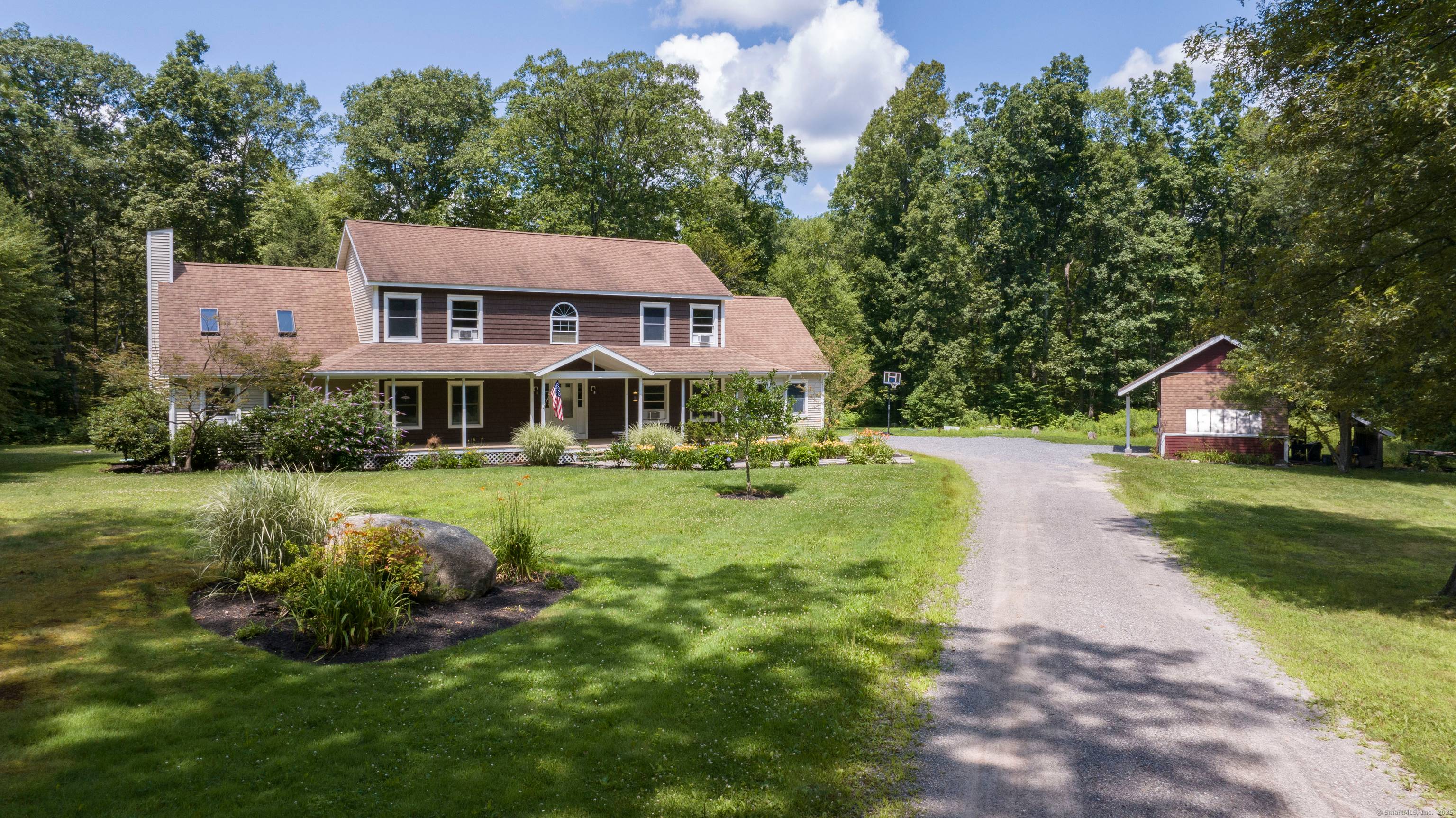 This beautiful sprawling custom colonial is set on 9 acres of land at the end of a winding long driveway and surrounded by open area.