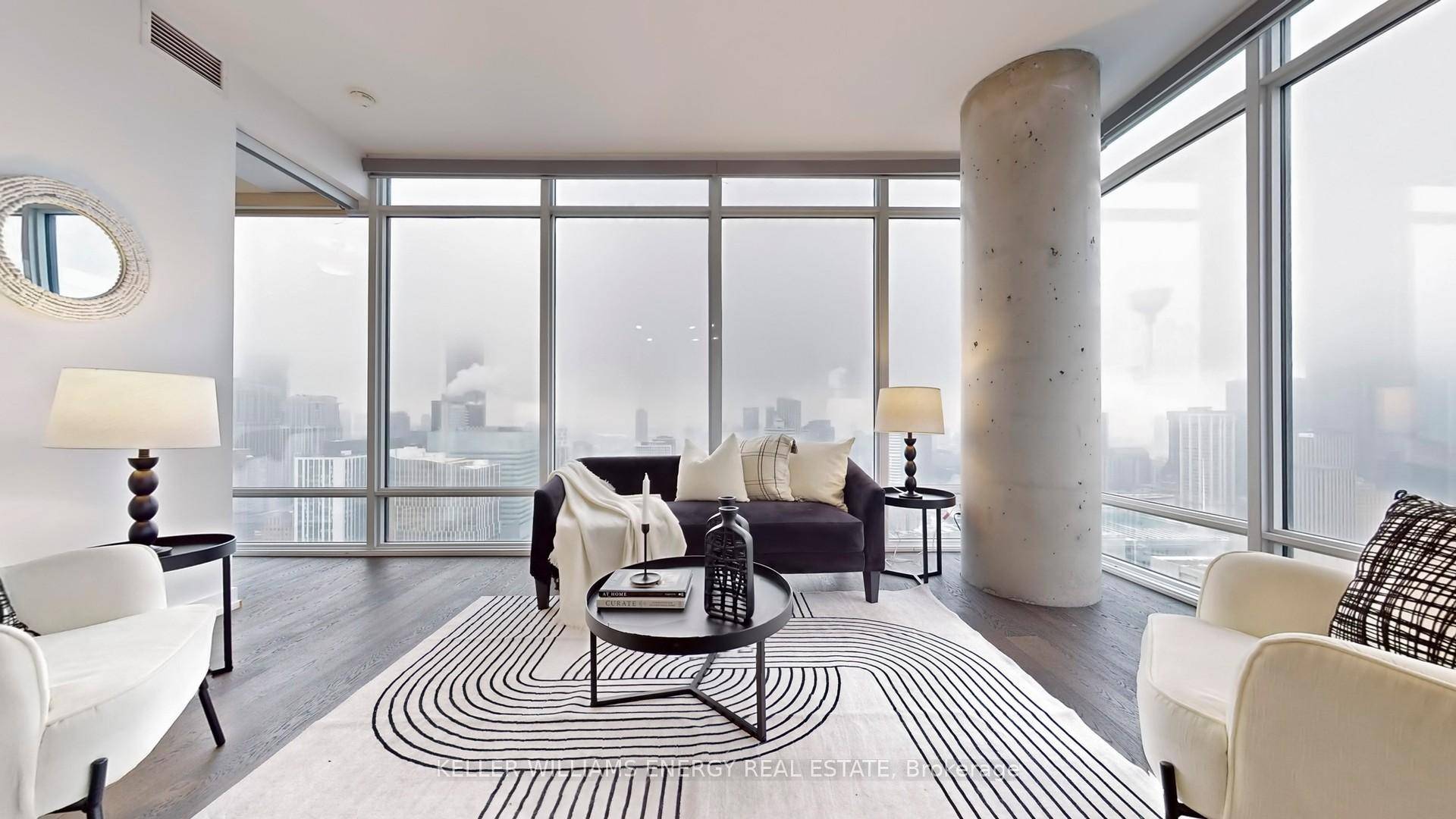 Step into this breathtaking corner unit, where the ceilings are high, the windows are floor to ceiling, and your jaw ?