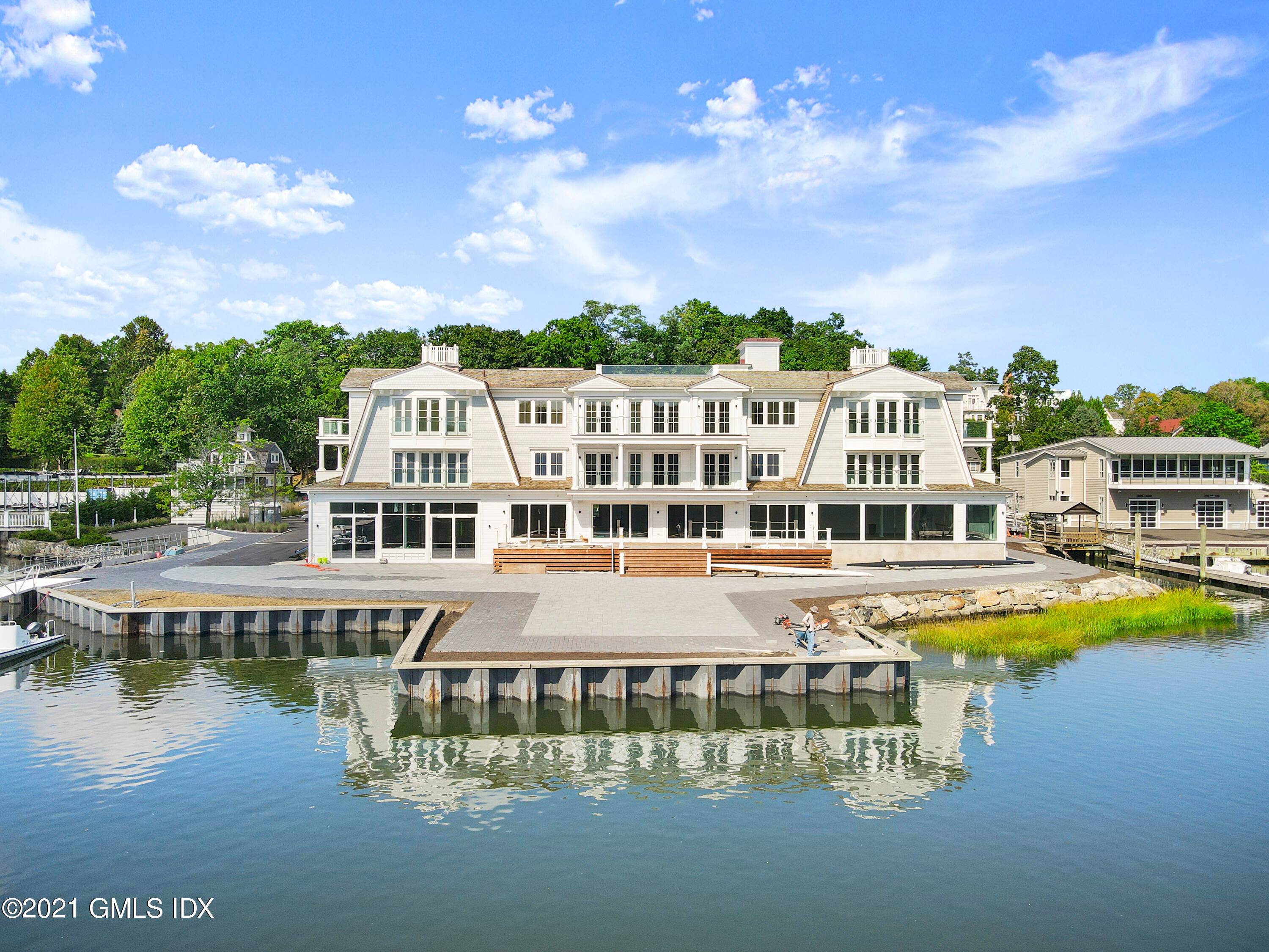 One of a kind direct Waterfront Shingle Style 12 unit condo association just completed and ready for summer occupancy.