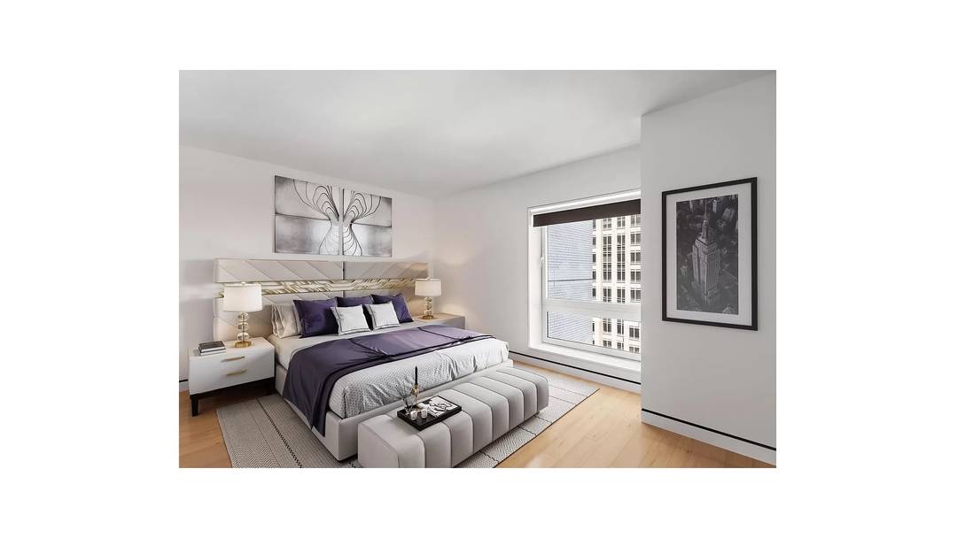 Elegant 904 square foot one bedroom, two bath residence with home office situated in the heart of Midtown, Manhattan at 135 W 52nd Street.