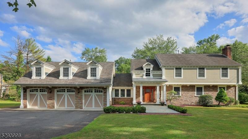 This exquisite 5 bedroom Colonial on 1.