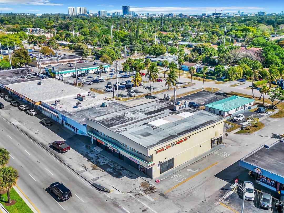 Located in the heart of the NE 163rd Street Commercial Business District, this iconic two story corner building offers a prime investment opportunity.