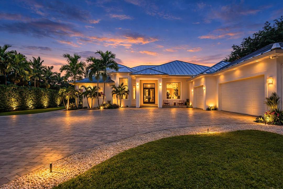 Nestled in the beautiful landscape of Southwest Ranches this exceptional estate offers casual luxury on over 2 acres of lush tropical grounds.