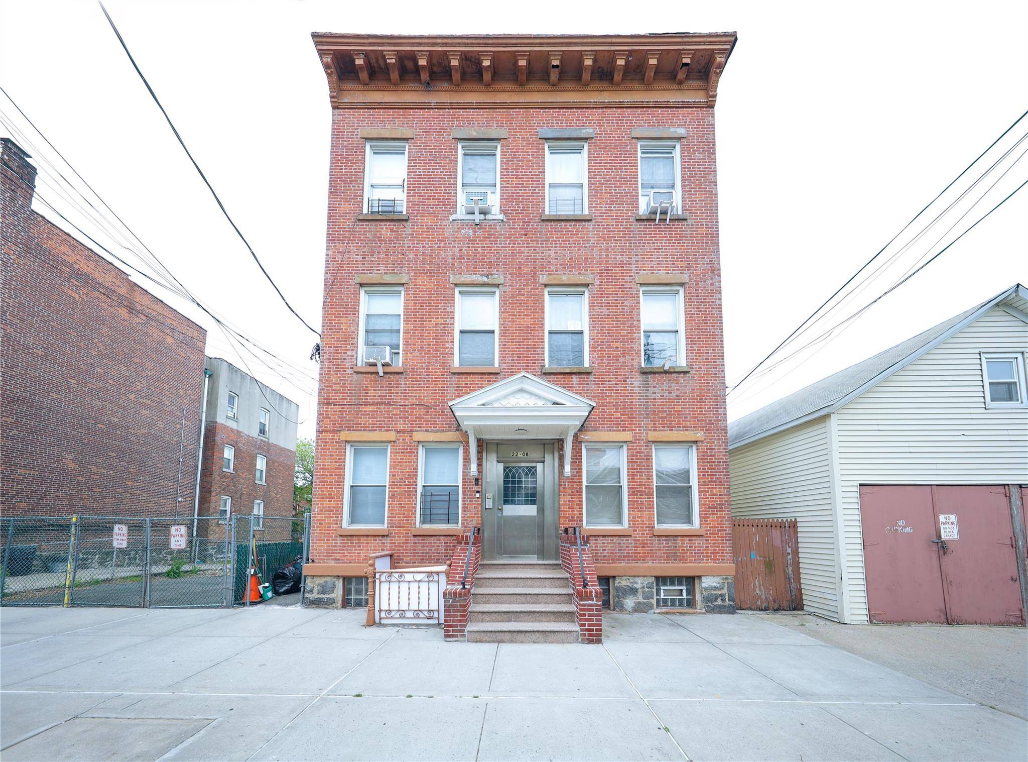 Investment Opportunity in College Point Detached Six Family Residence with Recent Upgrades and Private Driveway.