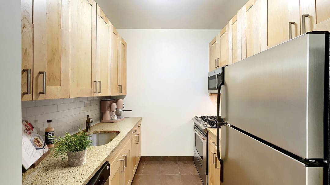 Well appointed studio apartment with great natural light and a newly renovated kitchen featuring stainless steel appliances and stone countertops.