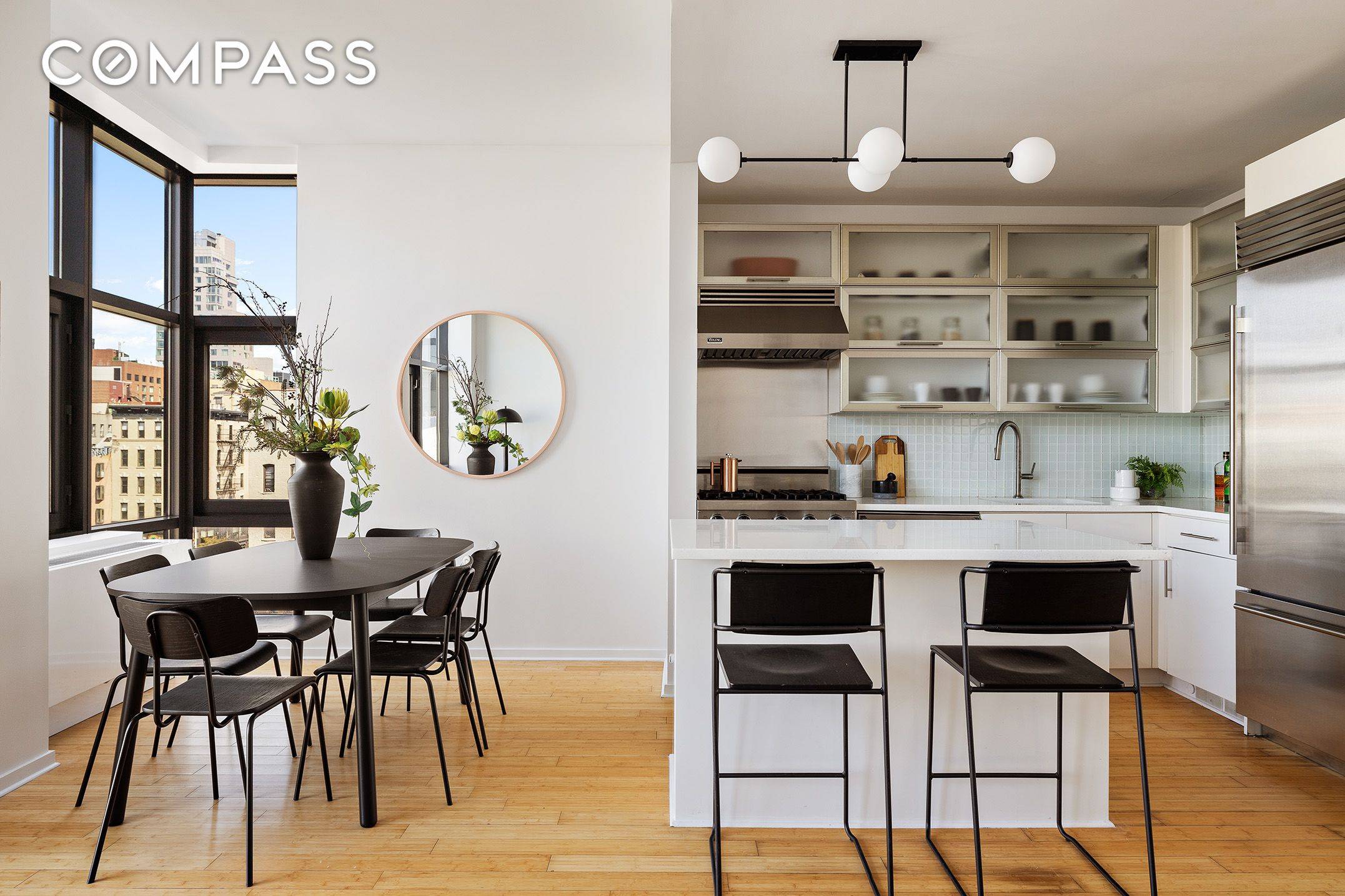 Residence 6A is a dramatic loft style condominium with nearly 10 foot ceilings, floor to ceiling windows, open skyline views of the Freedom Tower and historic downtown landmarks.