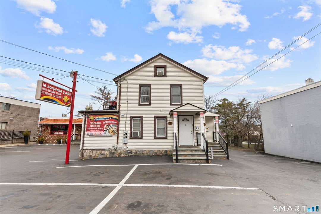 61 Cedar Street, Norwalk presents a rare mixed use investment opportunity featuring a well known Colombian restaurant along with a fully occupied residential building on the same property.