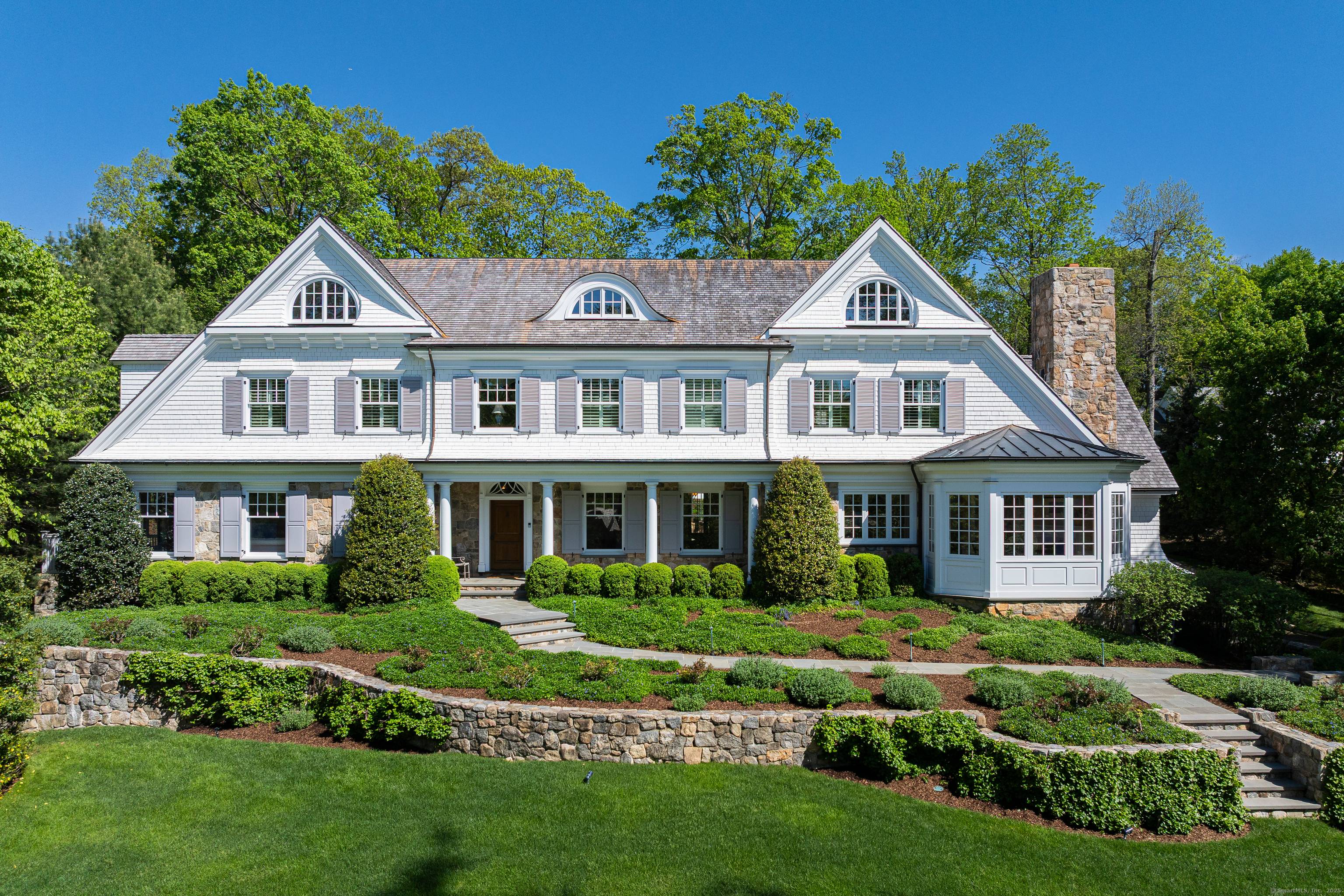 With timeless appeal, this quintessential New England stone shingle style colonial offers finely crafted architectural details with thoughtful design and exceptional quality.