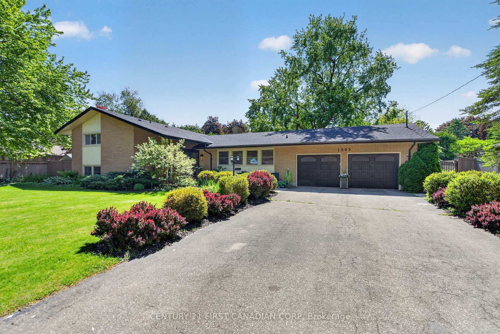 Welcome to a truly exceptional North London property an extraordinary opportunity to own a private retreat on a rare half acre lot within city limits.