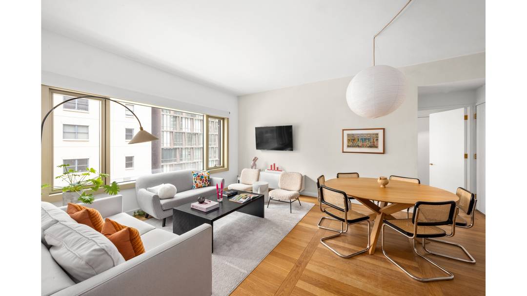 Welcome home to a thoughtfully designed 1, 265 square foot two bedroom, two and a half bath residence where scale, light, and proportion create effortless downtown living.