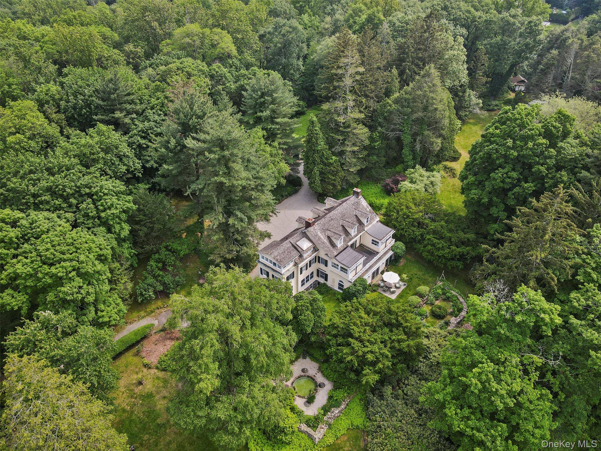 Set back from the road in one of Bedford s loveliest estate areas, down a tree lined drive, sits 328 McLain Street.