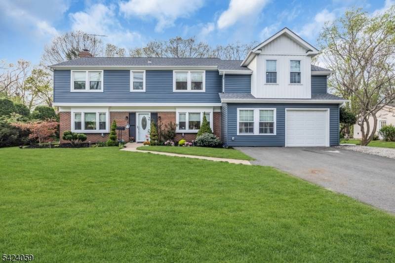 STUNNING fully renovated Colonial with 5 Bedrooms, 3 full baths, office rec room.