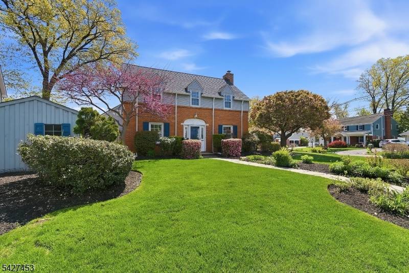 Stately and elegant brick Colonial home in one of central Bergen County's most idyllic neighborhoods !
