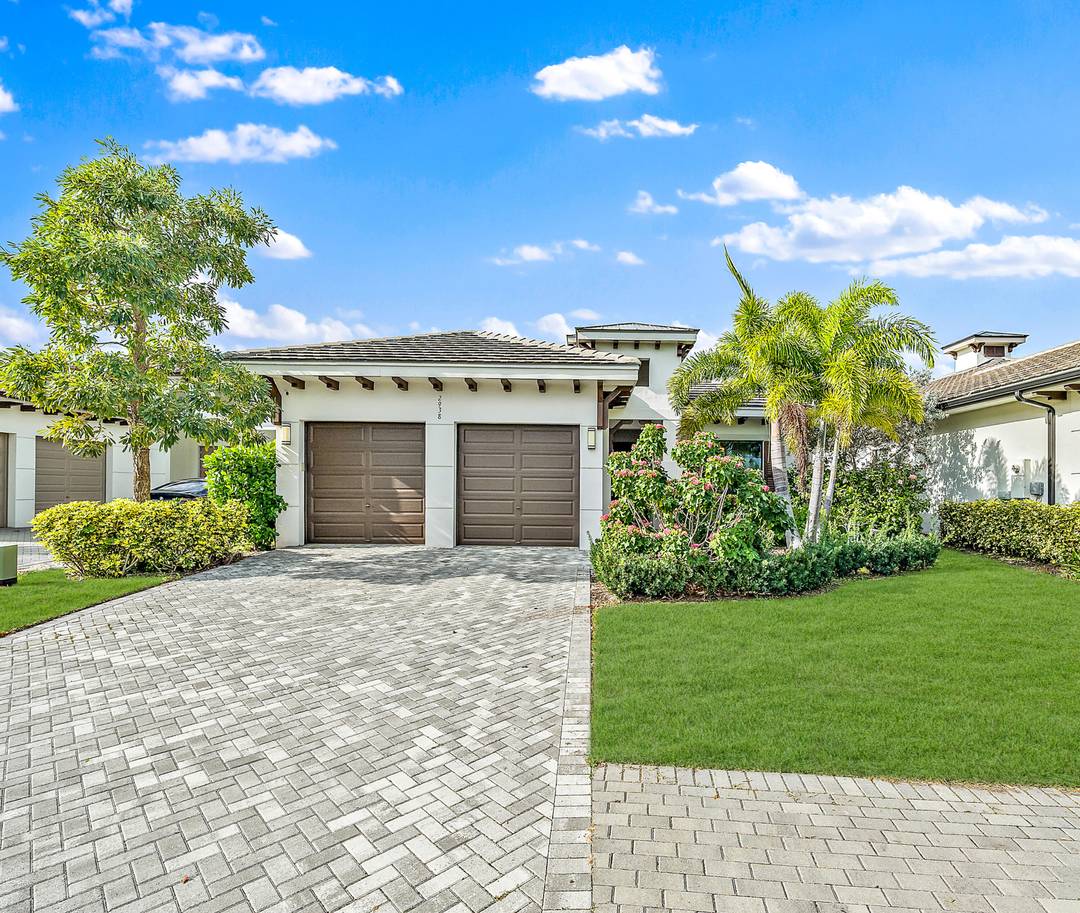 Modern, move in ready residence in Banyan Cay, a premier gated community in West Palm Beach.