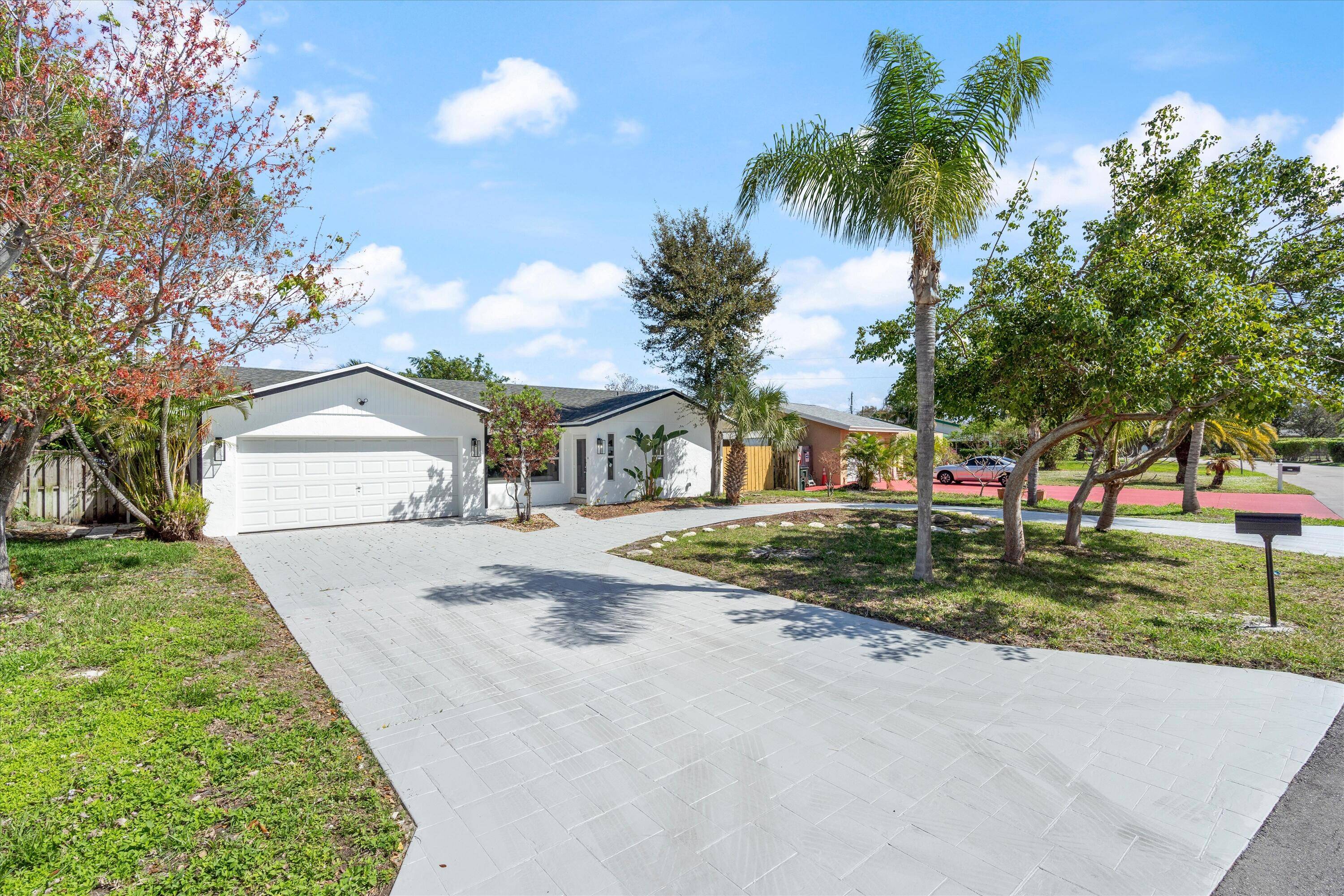 Welcome to this stunning 3 bedroom, 2 bathroom home in the highly sought after Tropic Palms community of Delray Beach with NO HOA !