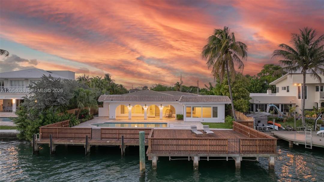 Enjoy waterfront living on Biscayne Bay in this one story home located in the gated community of Biscayne Point.