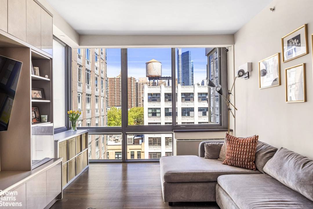 Experience refined West Side living in this bright and beautifully maintained corner two bedroom, two bath residence at the Hudson Condominiums.