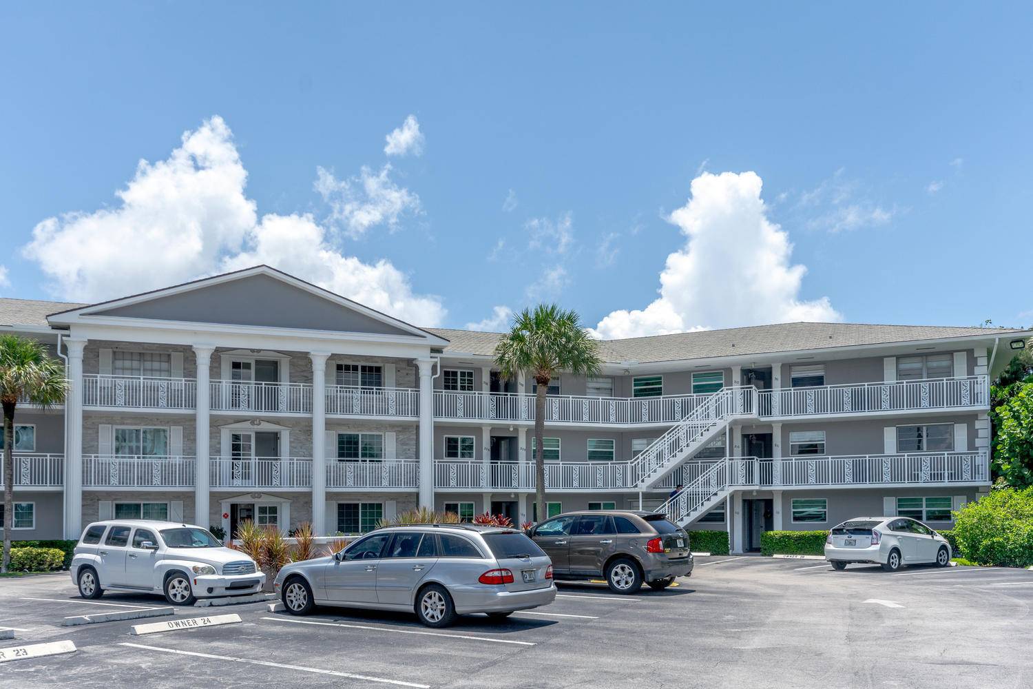 Completely redone first floor corner unit overlooking Pelican Lake and steps to the beach.