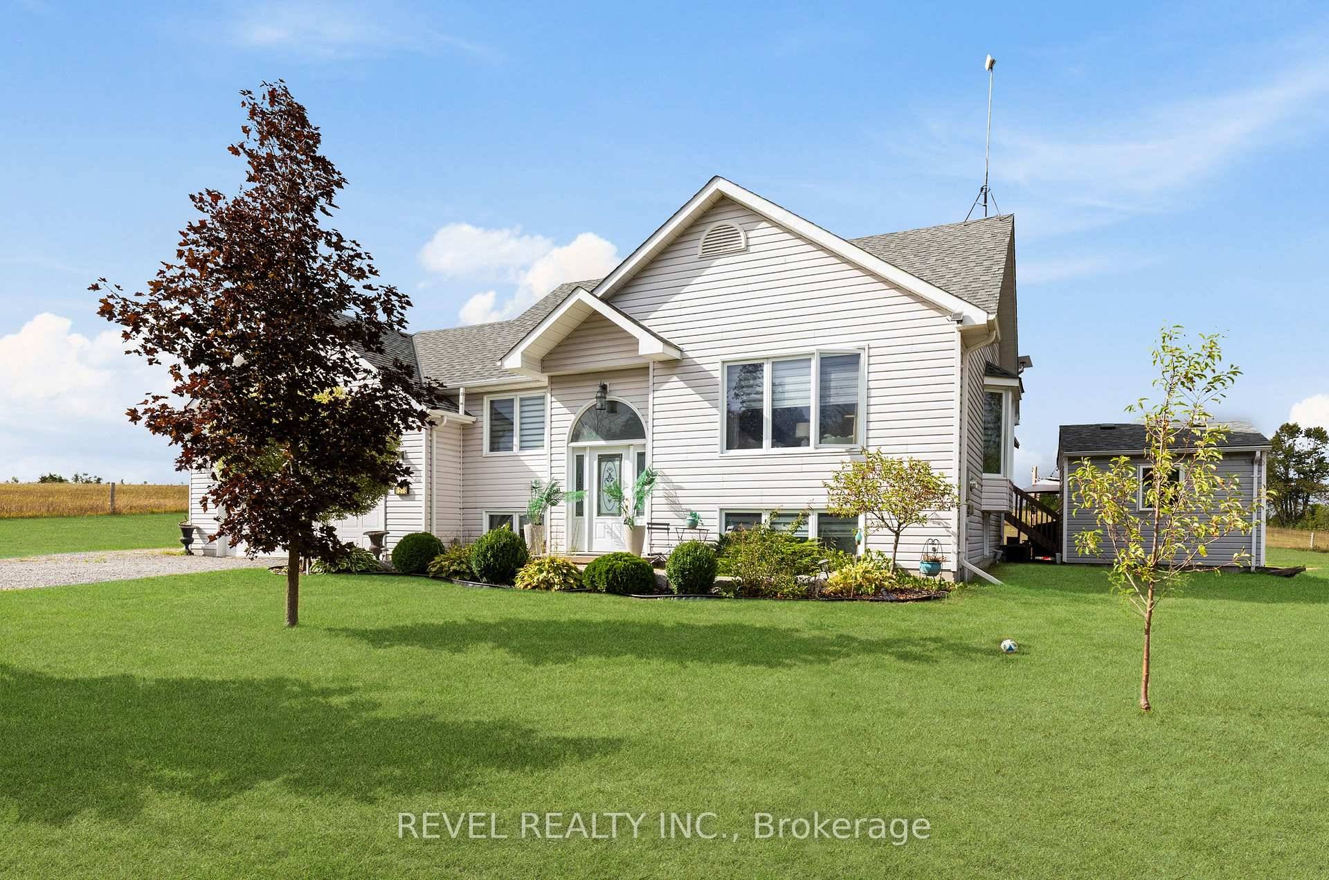 Welcome home to this beautifully crafted 5 bedroom, 3 bath raised bungalow, built in 2006 and set on a private 1.