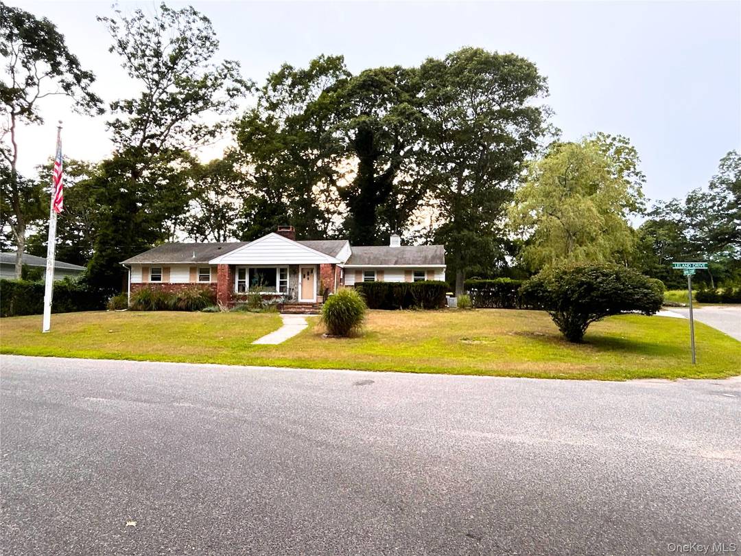 Charming ranch style home featuring 3 bedrooms, 2 bathrooms, and a spacious 2 car garage, perfectly situated on a corner lot along a quiet street.