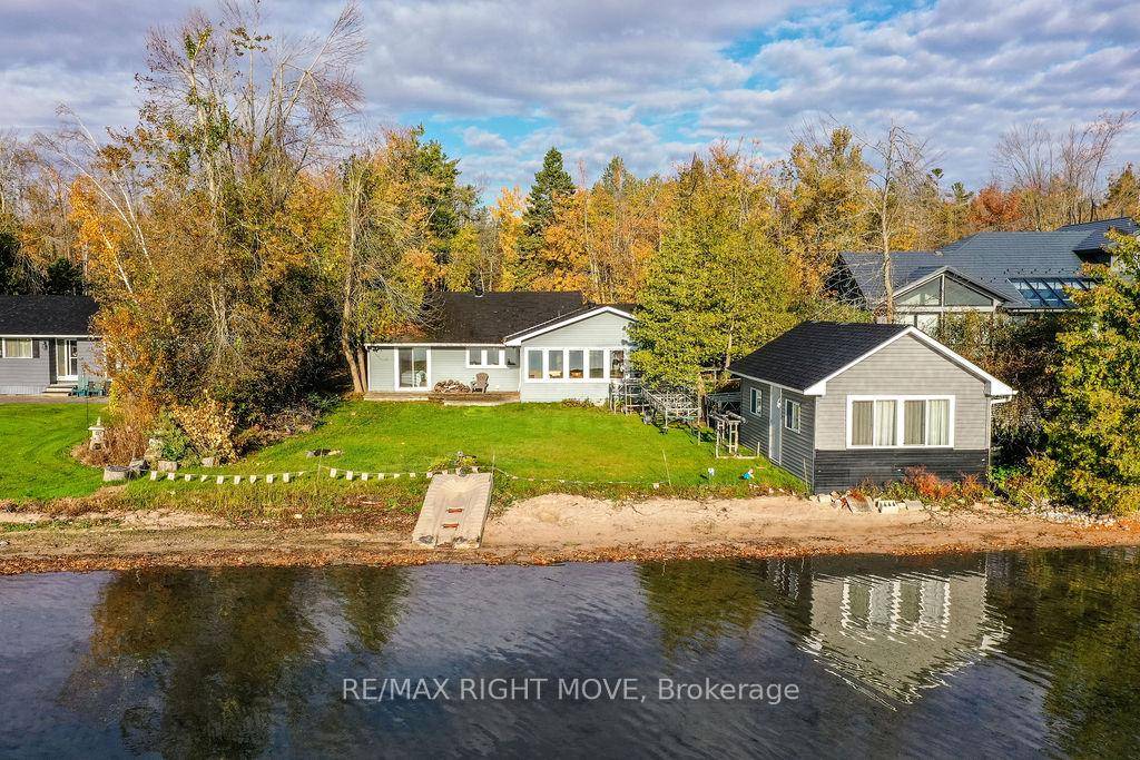 Discover the perfect blend of lakeside tranquility and year round comfort in this 4 bedroom, 1.