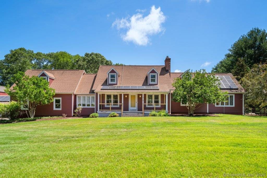 Welcome to this charming and surprisingly spacious 3 bedroom Cape style farmhouse, set on over 3.