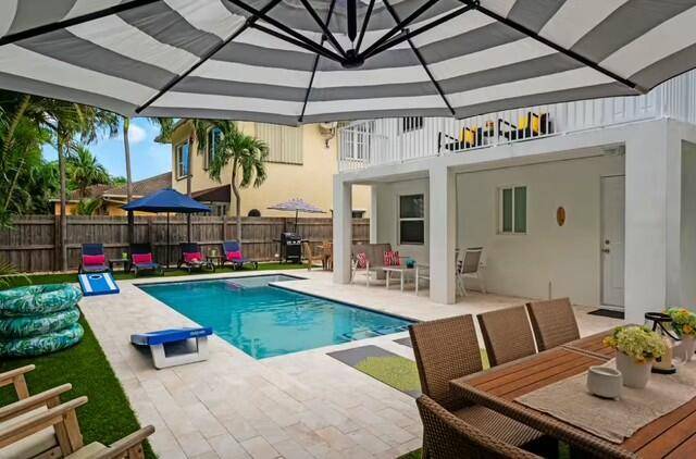 Fully furnished 4 2 down stairs unit of Duplex with shared resort style pool and backyard.