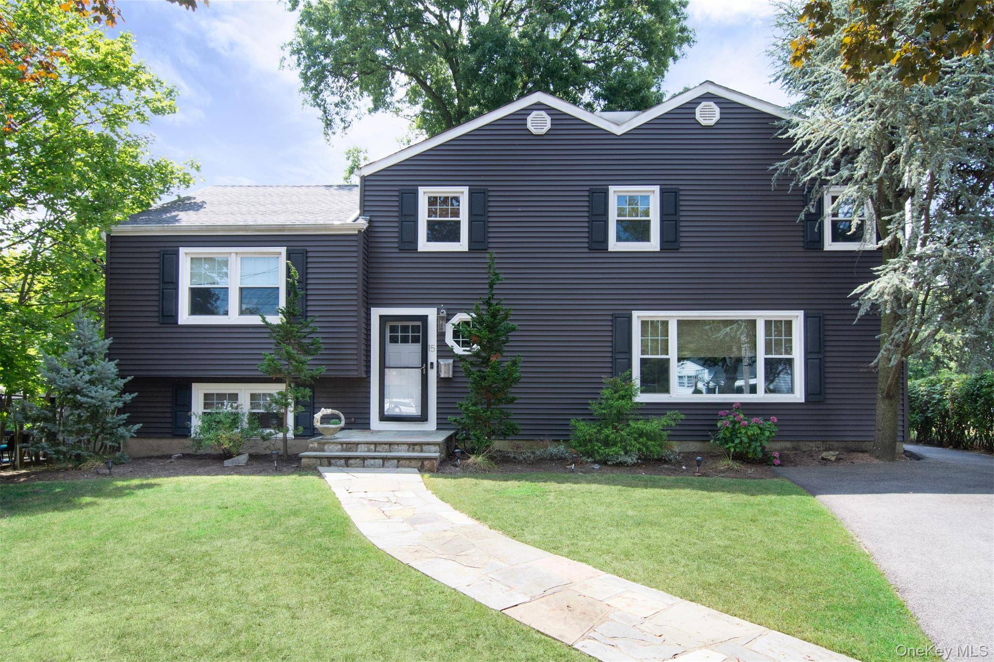 Exceptional and Rare Opportunity for this Split Level Home with In Law Suite in Westchester Hills !