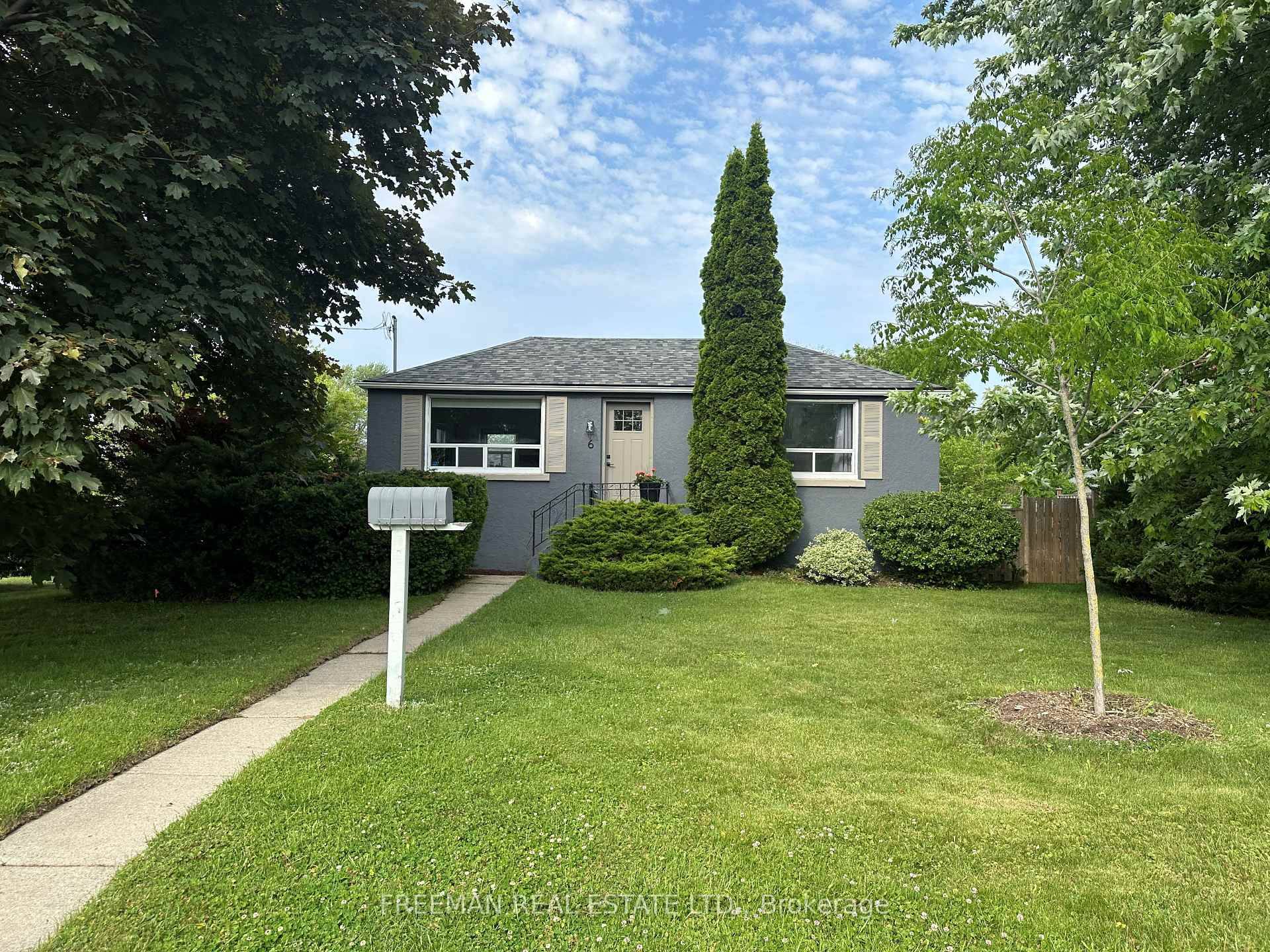 Huge sunny S E facing corner lot with detached garage and double driveway.