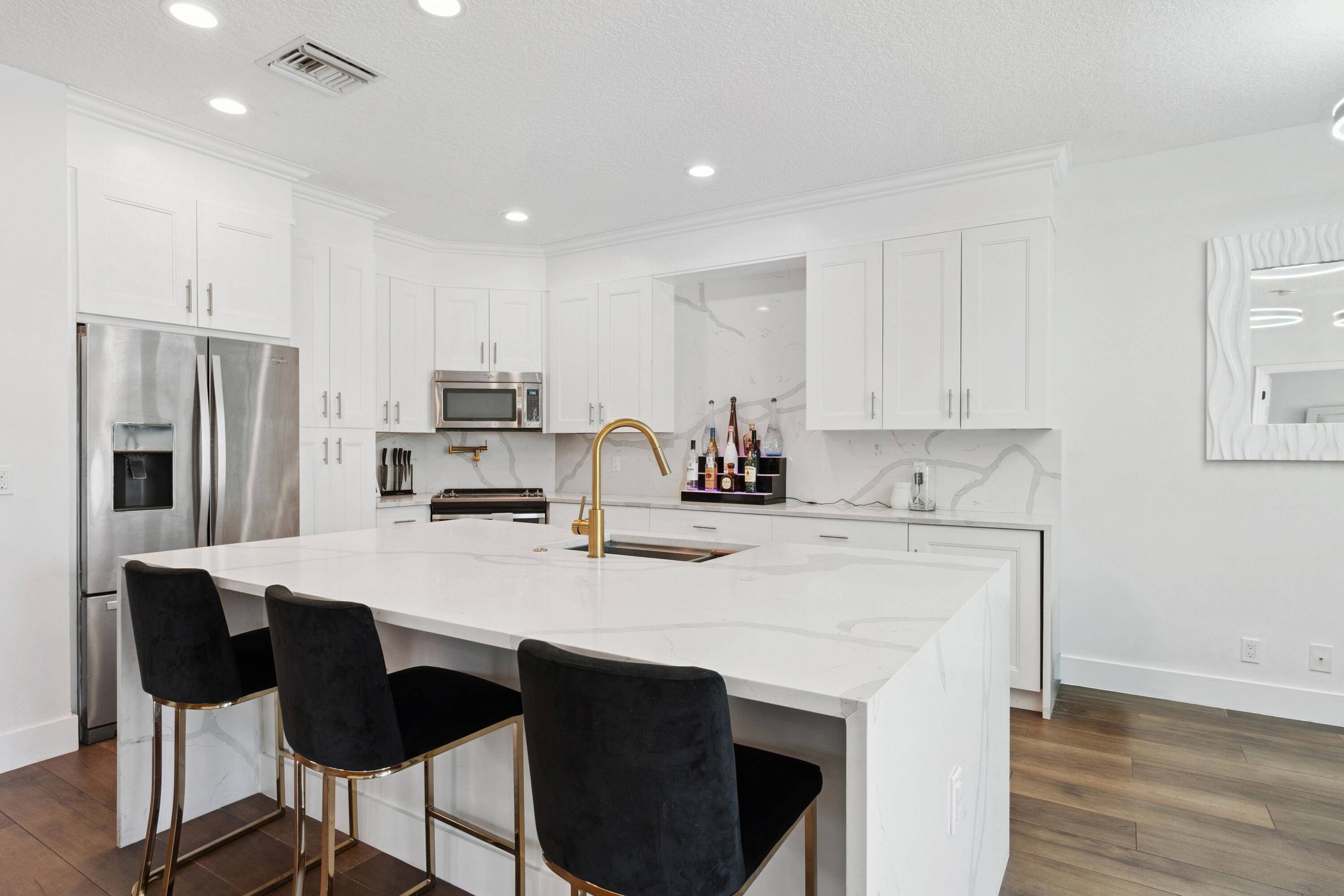 Step into this stunningly renovated 3 bedroom, 2 bathroom home nestled in the prestigious gated community of Boca Preserve, a rare find in the heart of East Boca.