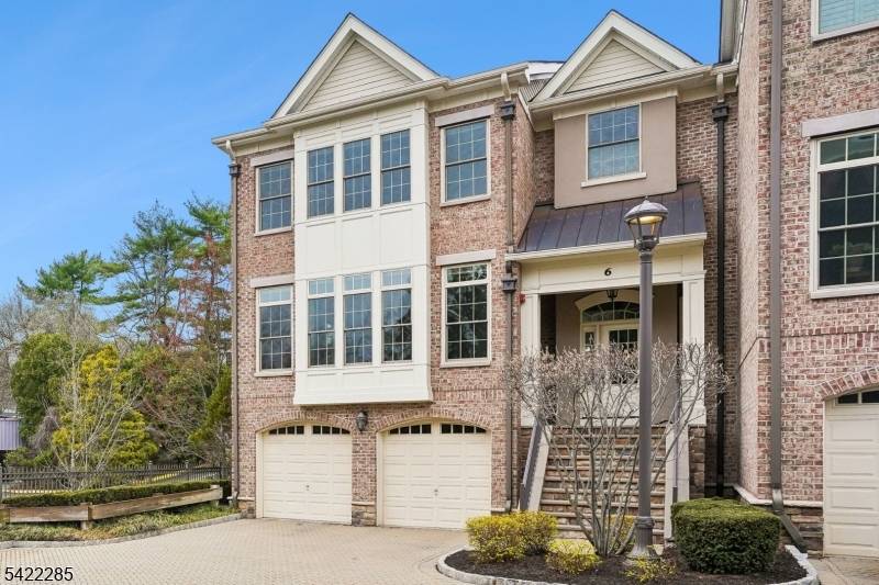 A rare offering in The Brownstones, this sophisticated end unit townhome captures the timeless appeal of a classic New York style brownstone in Convent Station.