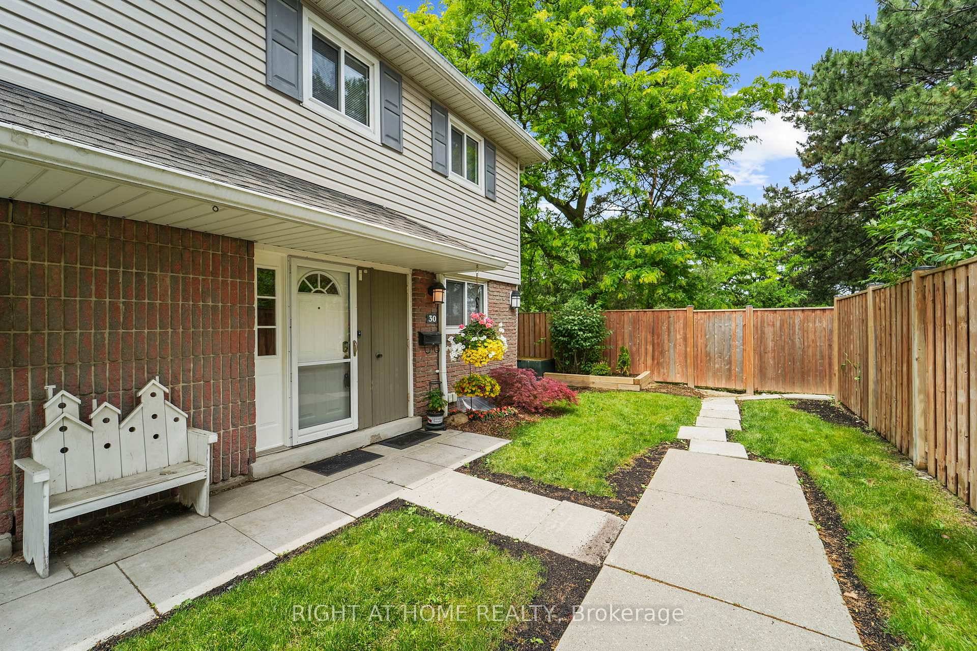 Charming End Unit Townhome in Peel Village A Private Backyard Oasis Awaits !