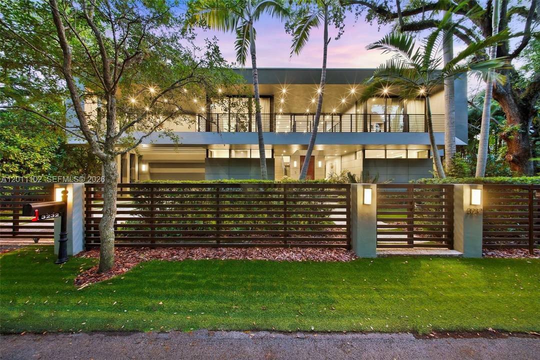 Stunning Coconut Grove residence showcasing soaring ceilings and an abundance of natural light.