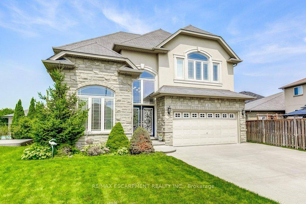 Rare find ! Main level granny flat nanny suite includes a private bedroom, full bathroom plus a living space with a kitchenette ideal for aging parents or live in support.