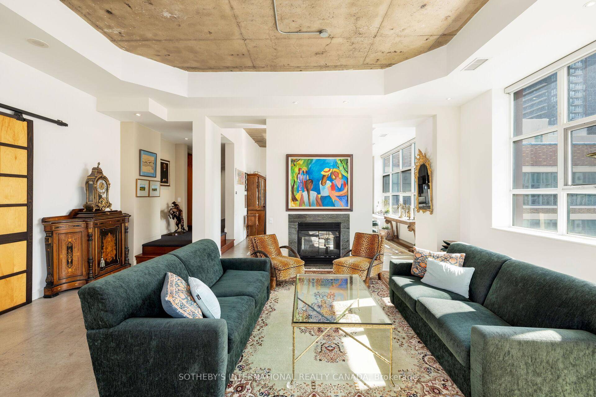 Overflowing with personality, this stylish and sun filled New York style hard loft conversion commands an unparalleled view of thriving downtown Toronto from your house in the sky.