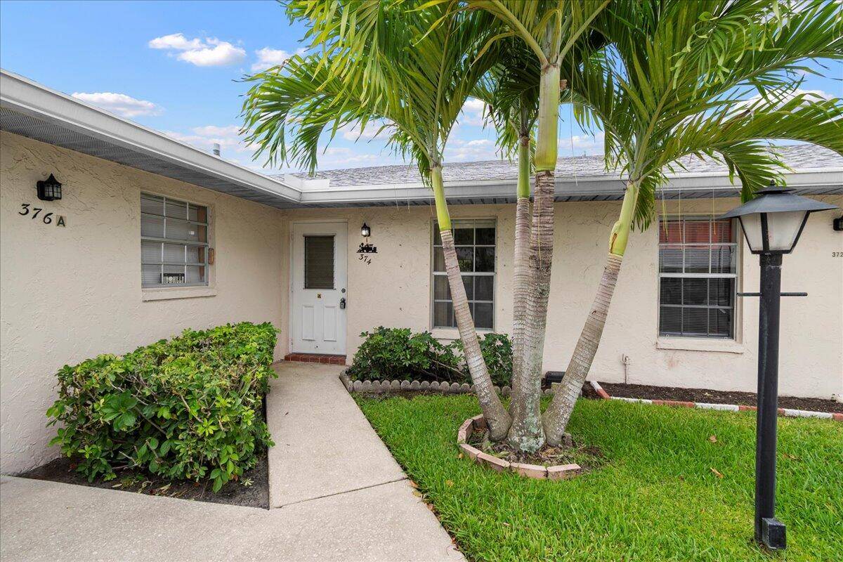 Discover this absolutely spectacular 2 bedroom, 2 bath unit at 374 Bennington Lane in Covered Bridge, a highly desirable and pet friendly 55 community in Lake Worth, Florida.
