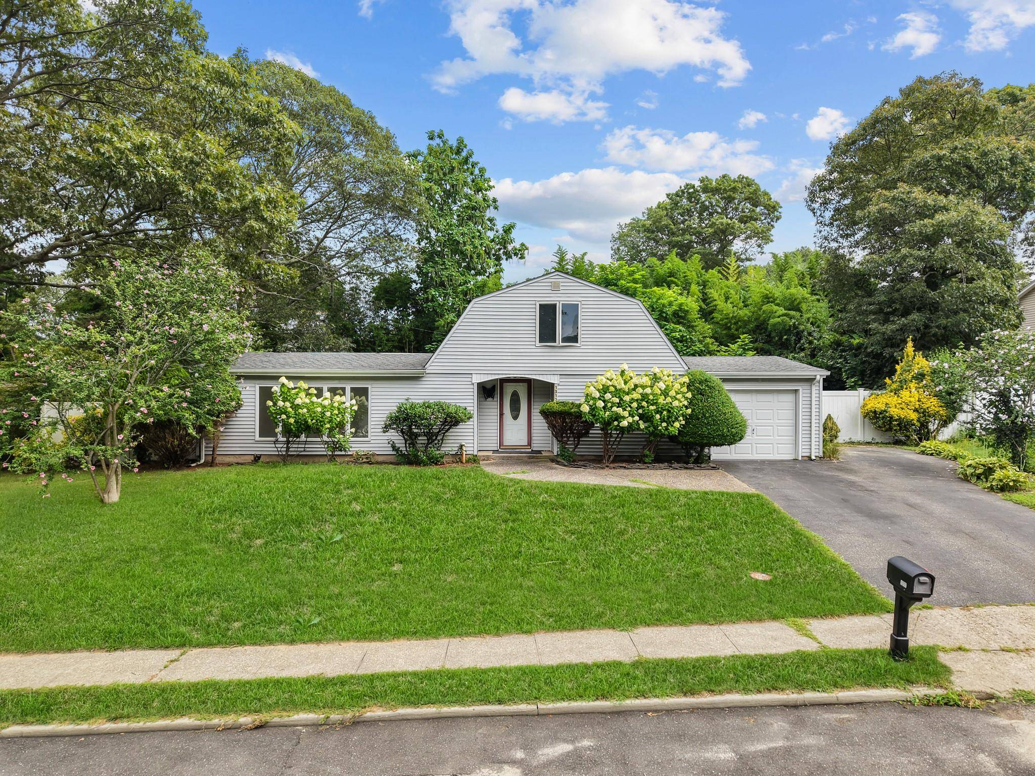 Charming Farm Ranch with Dormered Attic and Versatile Living Spaces.