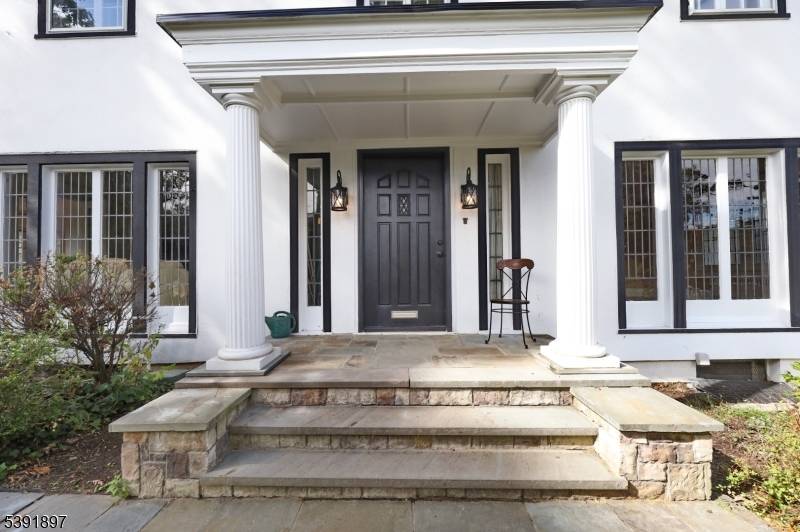 Discover timeless character in this French Colonial style Center Hall home, ideally situated in Paterson's prestigious Manor Section.