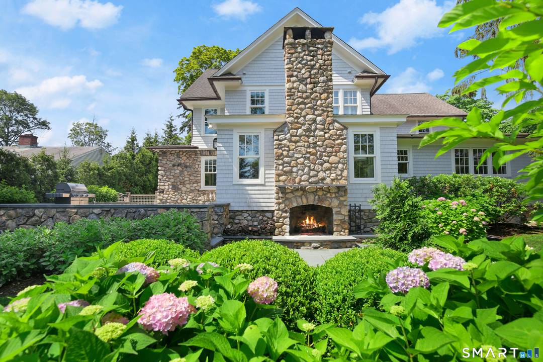 This distinguished Colonial, originally built in 1911, seamlessly blends timeless character with modern sophistication.