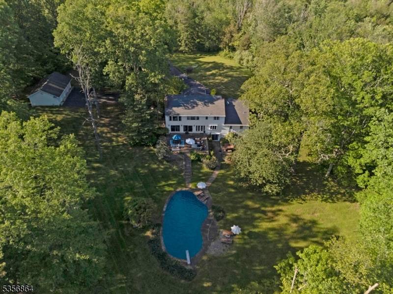 Welcome to this stately five bedroom Colonial, a heavenly sanctuary offering the ultimate in privacy and comfort.
