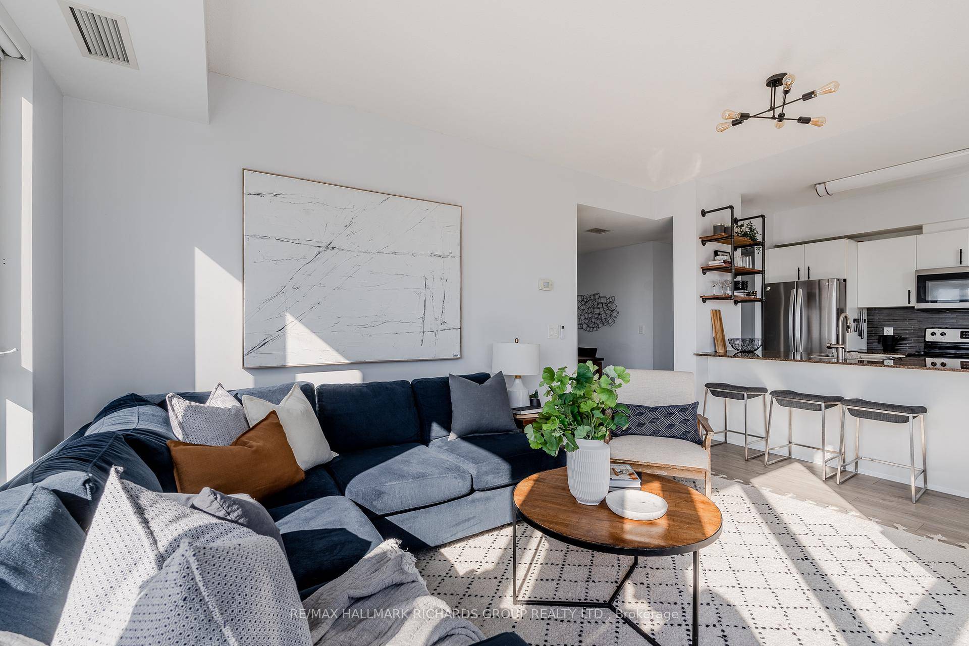 Welcome to this gorgeous 2 1 bedroom condo with an open layout flooded with natural light, creating a warm and inviting atmosphere throughout.