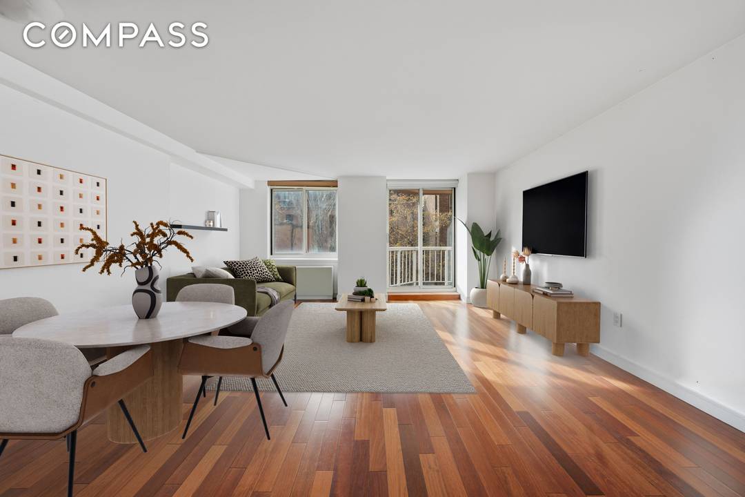 Spacious one bedroom condo in a full service building with two private balconies and deeded storage, ideally located between the Q and 6 trains.