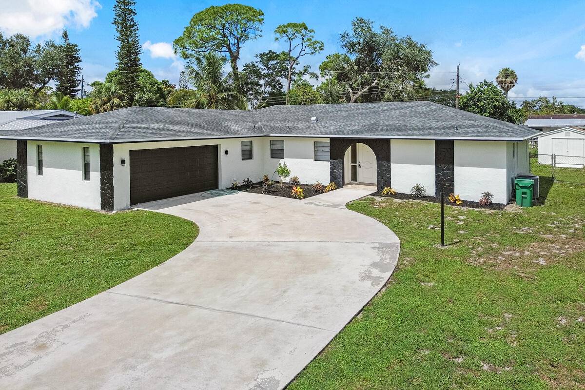 Beautifully updated 3 bedroom, 2 bath, 2 car garage home with new roof, new A C, new water heater, and new appliances.