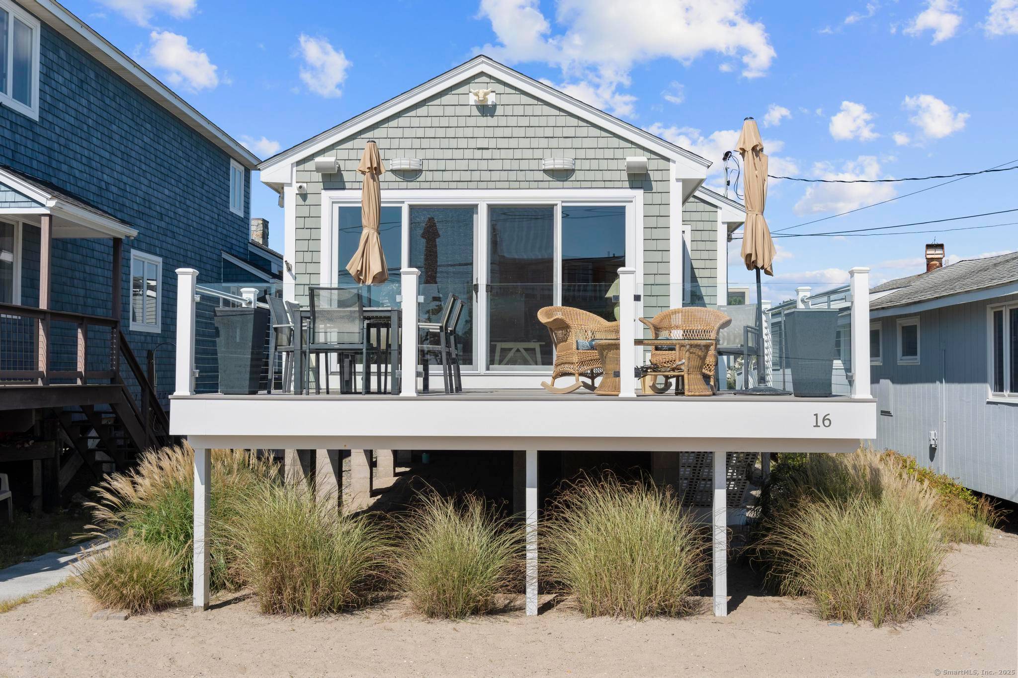 Step into this beautifully renovated 2 bedroom, 1 1 2 bathroom coastal haven, where luxury meets relaxed beachside living.