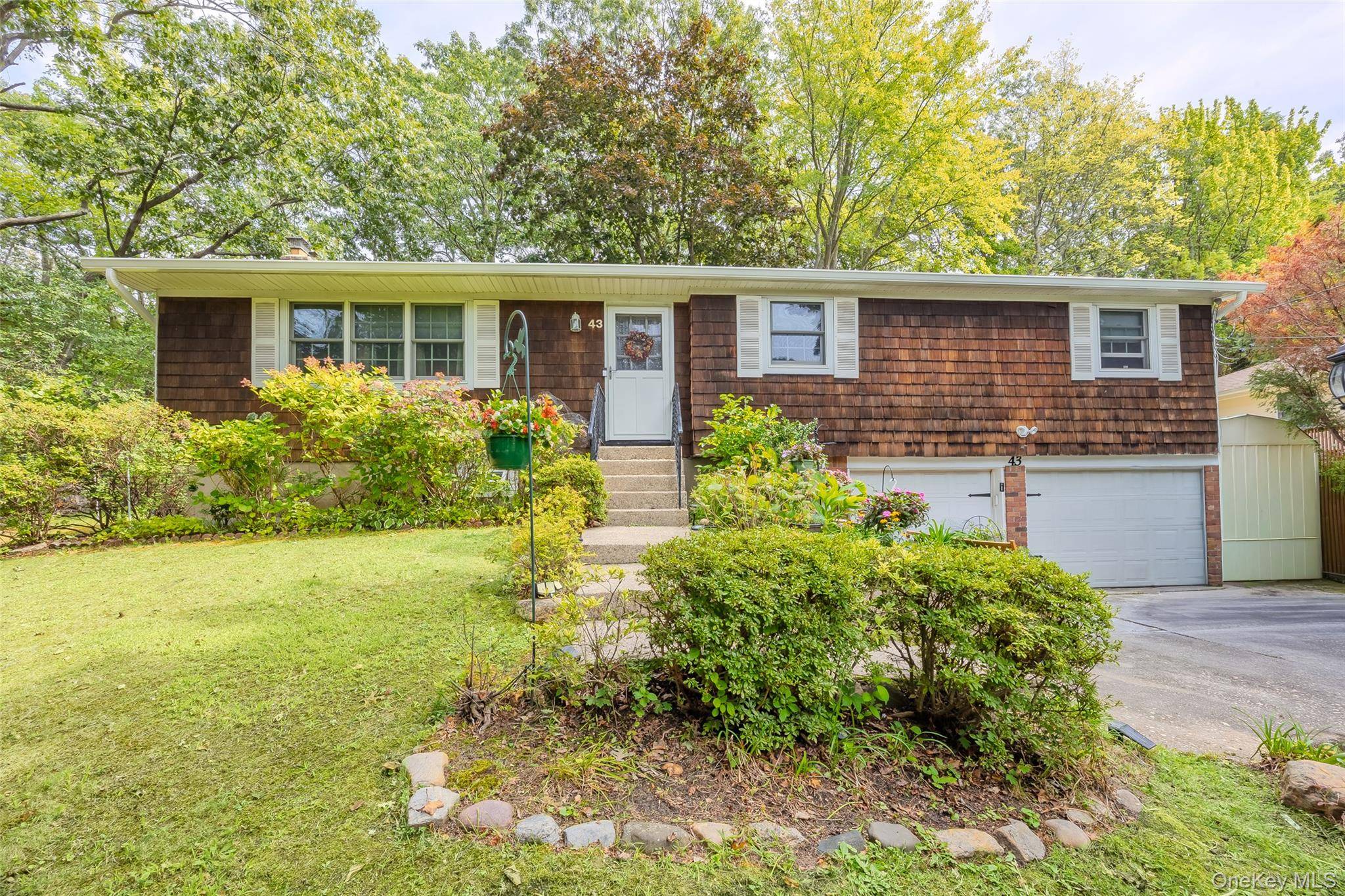 Oversized 3 Bedroom Ranch in Miller Place Schools with a full Basement and 2 car garage !