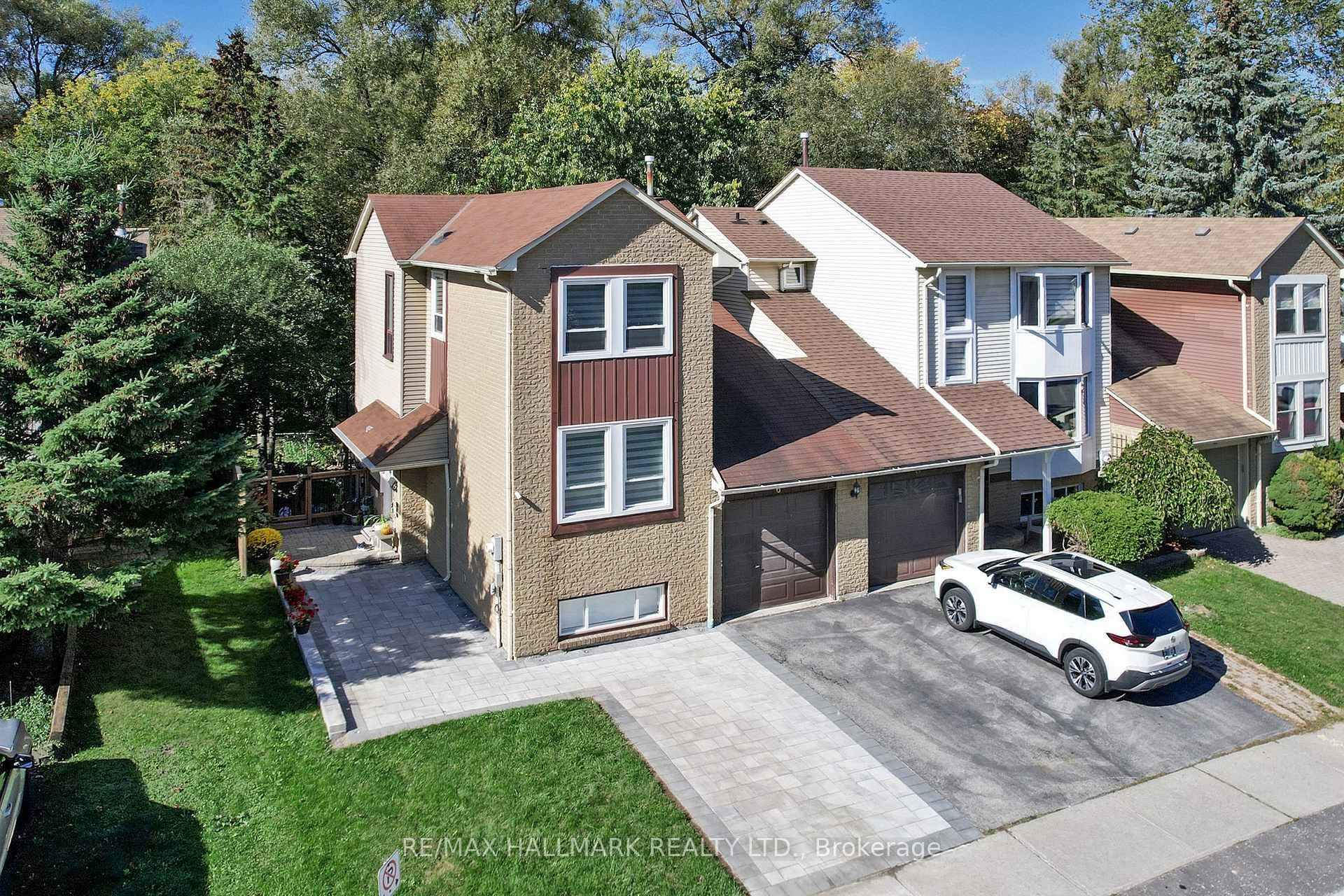 Experience modern luxury and tranquillity in this beautifully renovated freehold townhome, which is only attached by the garage.